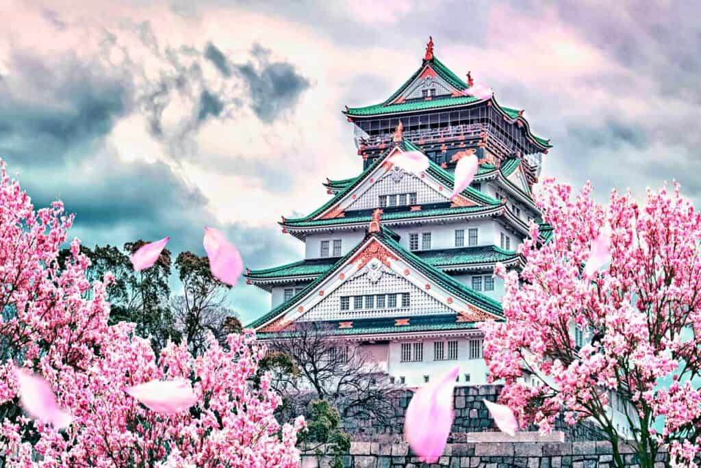 Osaka Castle framed by cherry blossoms in sprintime